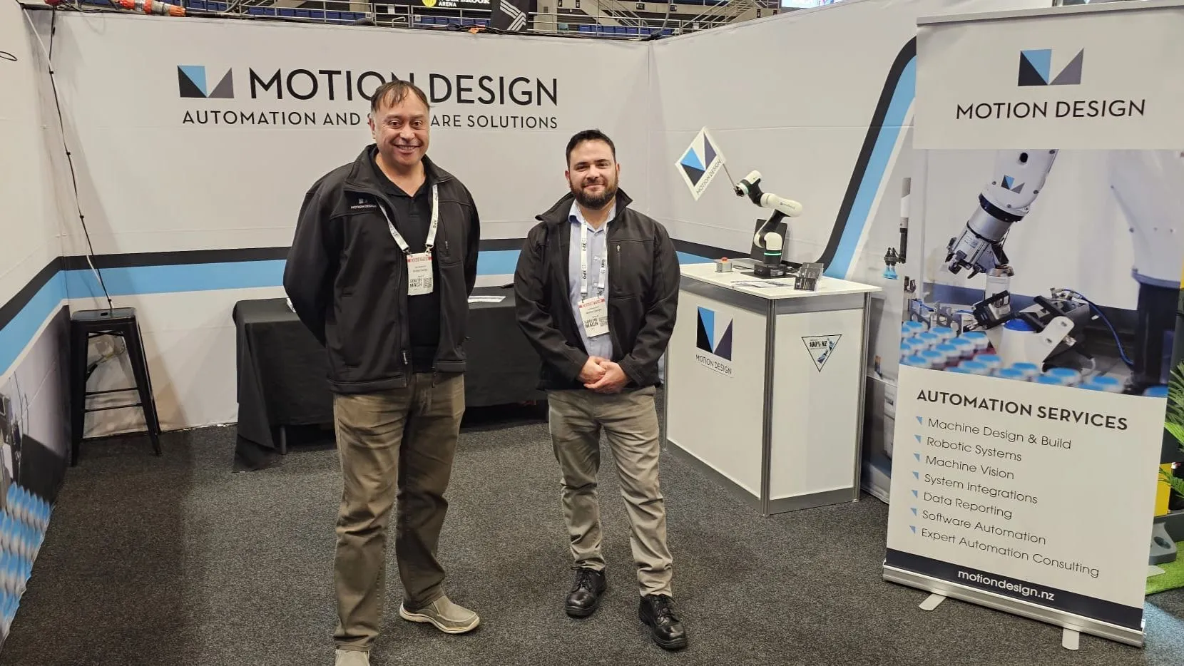 Gary and Guillermo standing at the Motion Design booth at SouthMACH 2025